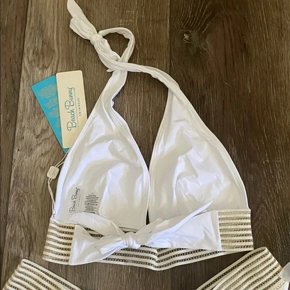 NWT Beach Bunny White and Gold Bikini 2 piece set
Halter top (L)
Bottoms (XL) - Picture 5 of 9